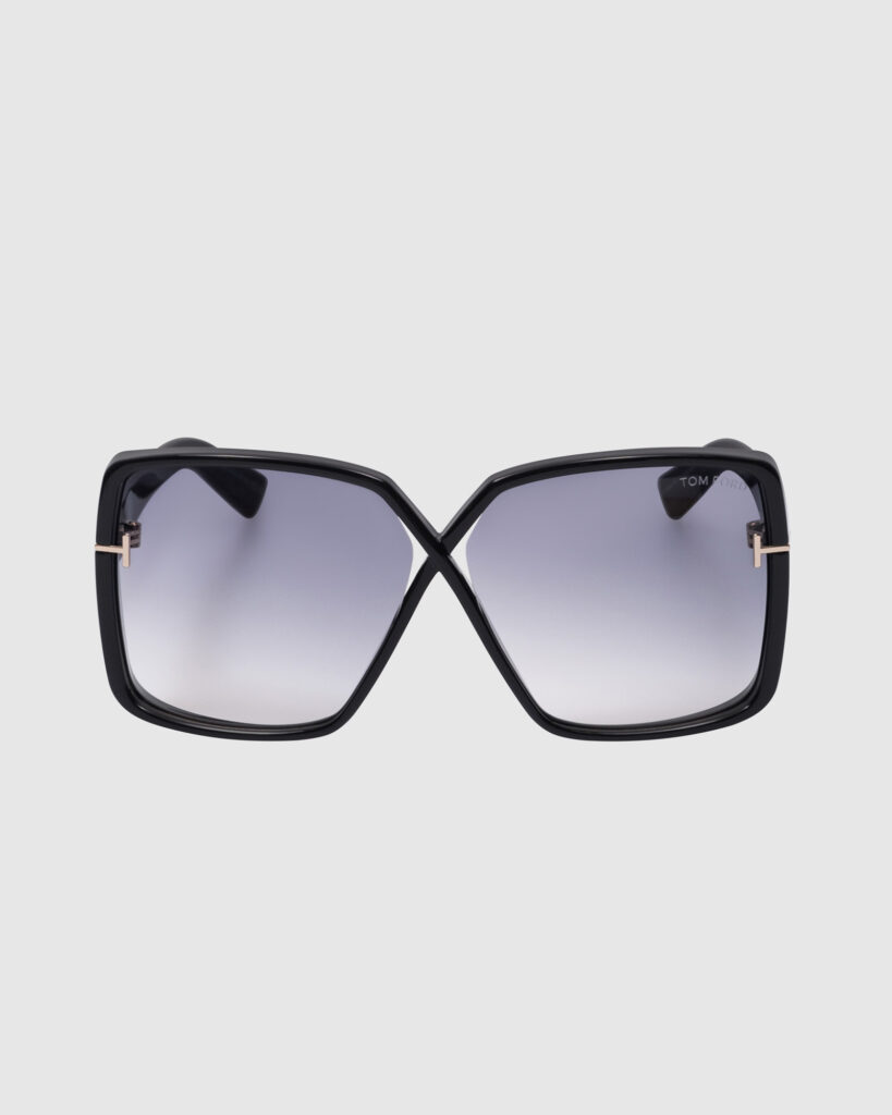 Tom Ford black oversized square sunglasses with grey gradient lenses and gold T-logo detail, shot on a clean white background for e-commerce.